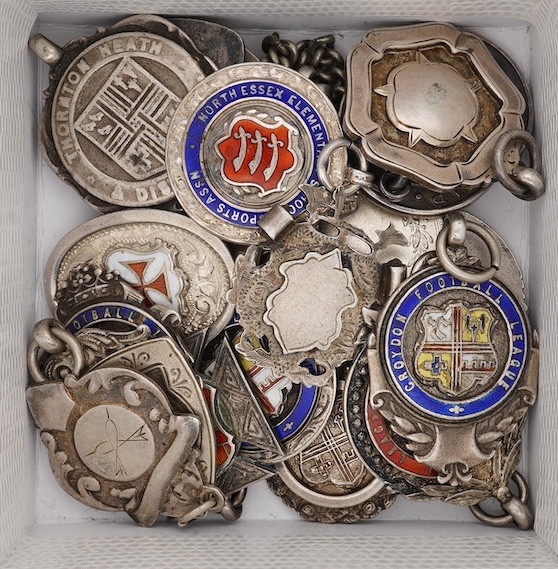 A group of twenty one assorted early 20th century silver and enamel award medals, mostly sporting. Condition - poor to fair